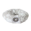 Fluffy white donut-shaped pet bed on a white background