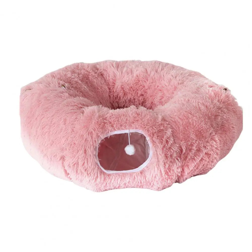 Pink fluffy pet bed on a white background