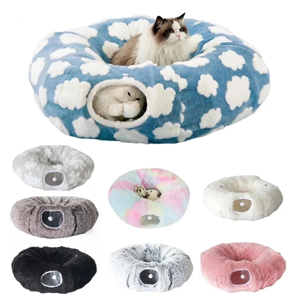 Collection of donut-shaped pet beds with various patterns and colors, featuring a cat on one of them.