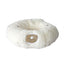 White fluffy donut-shaped pet bed on a white background